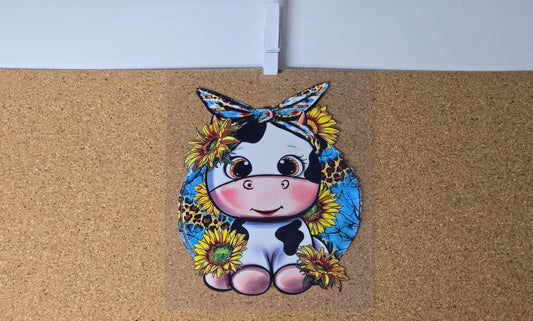 Cow with bandana and sunflowers