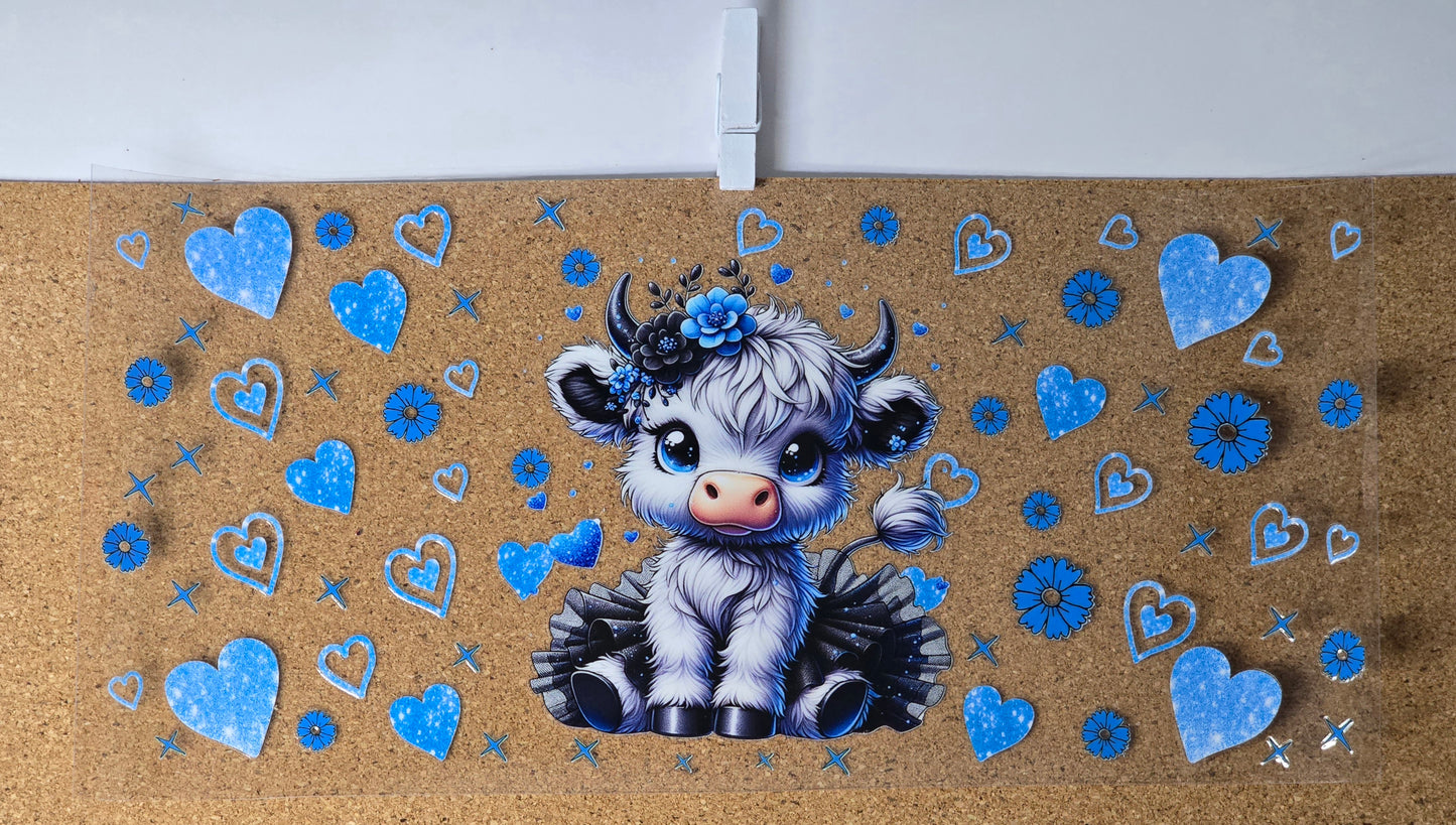 Cow with blue hearts